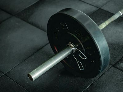 Simple fitness equipment on a dark wooden floor.